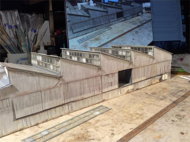 The making of SAWTOOTH warehouse. Photo lamination, windows and design